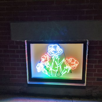 Superette - Neon signage for the store's windows as viewed from the sidewalk outside. December 2020 - Cannabis Dispensaries Near Me - Toronto, Ontario