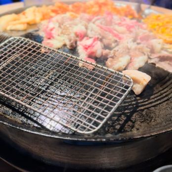 Pigya - Pig Gyu cooking on the cast iron griddle - Korean Near Me - Los Angeles, California
