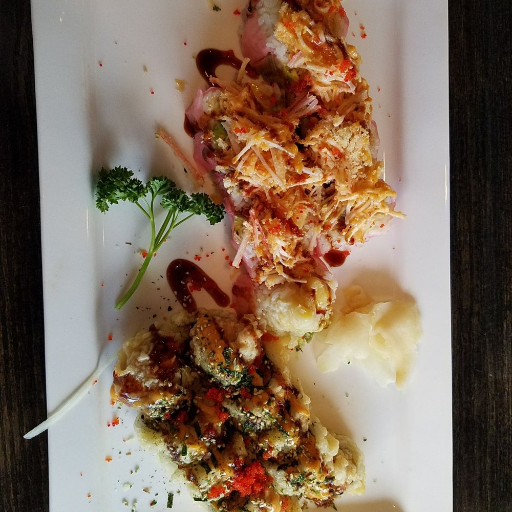 Sake Sushi - The one in the pink nori is a banana sushi, wanted to try something different and it was unique and tasty. The other is a BMW roll. - Sushi Bars Near Me - Chaska, Minnesota Sake Sushi - The one in the pink nori is a banana sushi, wanted to try something different and it was unique and tasty. The other is a BMW roll. - Sushi Bars Near Me - Chaska, Minnesota