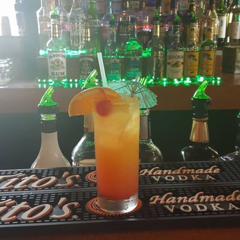 Pastime Club - a glass of orange juice on a bar - Pubs Near Me - Athol, Idaho Pastime Club - a glass of orange juice on a bar - Pubs Near Me - Athol, Idaho