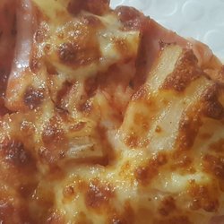 Red Swan Pizza - Hawaiian pizza slice. Can you find any pineapple?