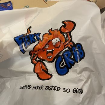 Fiery Crab Seafood Restaurant And Bar - a lobster on a plastic bag - Seafood Near Me - Harvey, Louisiana