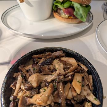 ROSÉLYS RESTAURANT - Burger and Fries with a side of sauteed mushrooms for the burger. - Bistros Near Me - Montreal, Quebec ROSÉLYS RESTAURANT - Burger and Fries with a side of sauteed mushrooms for the burger. - Bistros Near Me - Montreal, Quebec