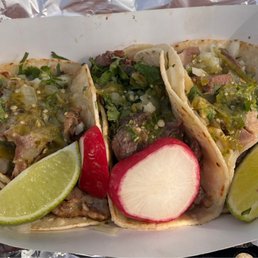 Pork taco on the left, beef tongue on the right...the middle one is beef something-else . All three were delicious. Pork taco on the left, beef tongue on the right...the middle one is beef something-else . All three were delicious.