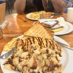 Egg omelet with Brie , fig jam , balsamic glaze and delicious home fries !