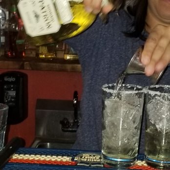 Holy Taco - a woman pouring a drink - Mexican Near Me - Johnson City, Tennessee Holy Taco - a woman pouring a drink - Mexican Near Me - Johnson City, Tennessee