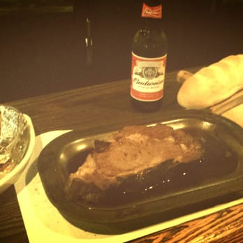 Flame Restaurant & Bar - Prime rib with baked potato and Budweiser - Lounges Near Me - Aberdeen, South Dakota