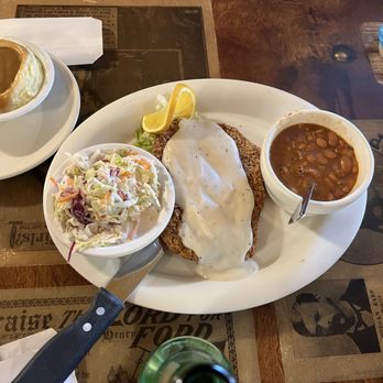 The Longhorn Restaurant - Country Fried Angus Steak,  beans, slaw and brown gravy over potatoes.  Damn good meal! - American Near Me - Tombstone, Arizona