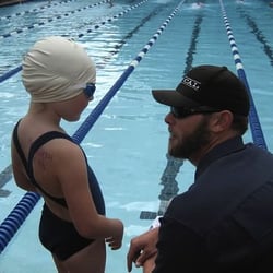Rasmussen Swimming - Coach Christian giving last minute tips before a race