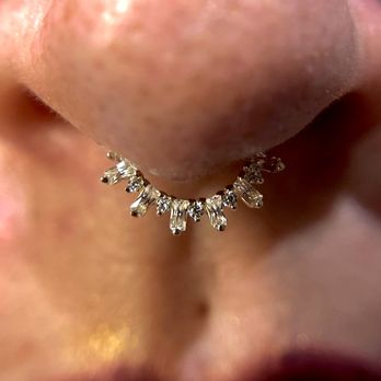 Kirakira Piercing - Fresh septum piercing performed with a decorative 14k solid gold clicker from Buddha Jewelry Organics. - Piercing Near Me - Honolulu, Hawaii