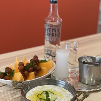 Lokum Eats - a plate of fruit and a bottle of vodka - Turkish Near Me - Toronto, Ontario