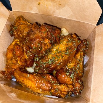 J's Creole Wings - $6 Wings jumbled up on top of the fries in a to go fries box - Chicken Wings Near Me - New Orleans, Louisiana