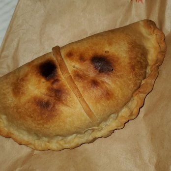 Empanada World Café - a piece of bread on a brown paper bag - Empanadas Near Me - Tampa, Florida Empanada World Café - a piece of bread on a brown paper bag - Empanadas Near Me - Tampa, Florida