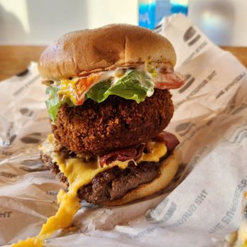 The Burger's Priest - a fried chicken sandwich with cheese and lettuce - Burgers Near Me - Toronto, Ontario The Burger's Priest - a fried chicken sandwich with cheese and lettuce - Burgers Near Me - Toronto, Ontario