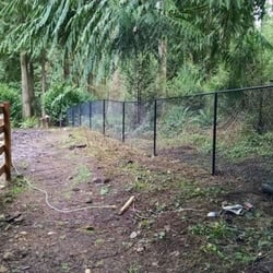 Contracting Northwest - 5 FT black chainlink fence on a farm property.