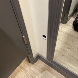 Torrid - Dressing room hole. What is in there, camera?