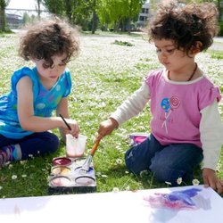 Hilltop Children's Center - Painting in flowers with a friend