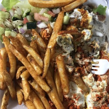 Halal Munchies - Combo (chicken and lamb) over rice platter with fries and salad. - Halal Near Me - Fresh Meadows, New York Halal Munchies - Combo (chicken and lamb) over rice platter with fries and salad. - Halal Near Me - Fresh Meadows, New York
