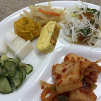 Kori Chicken - House made kimchi, salad, cucumber salad, rolled egg, radish, sweet potato, potato with carrot. - Korean Near Me - Orlando, Florida Kori Chicken - House made kimchi, salad, cucumber salad, rolled egg, radish, sweet potato, potato with carrot. - Korean Near Me - Orlando, Florida