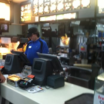 McDonald's - a man behind the counter talking on the phone - Burgers Near Me - Eddyville, Kentucky