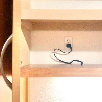 Firefly Electric & Solar  - Easily accessible switched duplex outlets hidden behind cabinet doors - Electricians Near Me - Gilbert, Arizona
