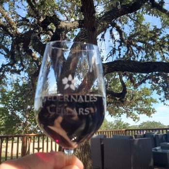 Pedernales Cellars - Great glass of red wine on the patio at Pedernales Cellars. - Wineries Near Me - Stonewall, Texas Pedernales Cellars - Great glass of red wine on the patio at Pedernales Cellars. - Wineries Near Me - Stonewall, Texas