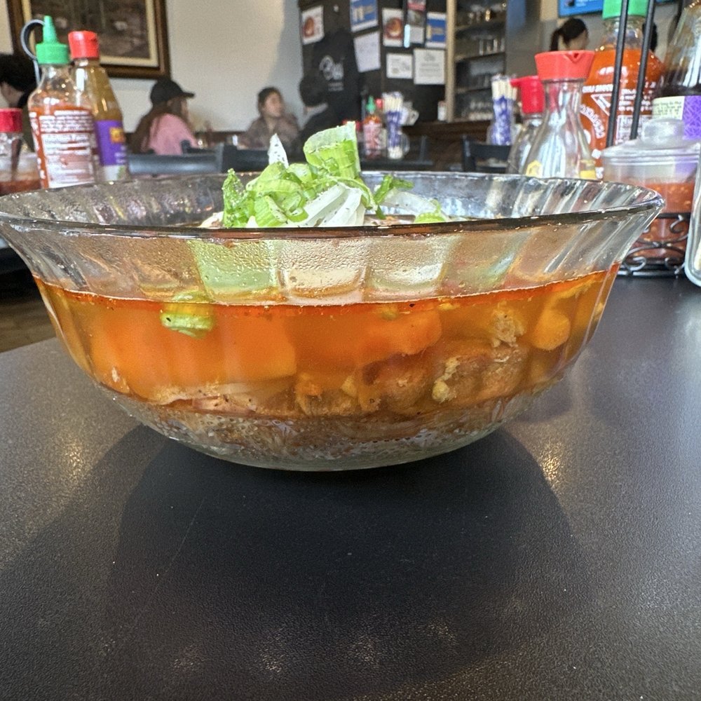 Cafe Nhan - Side view of Beef brisket stew with carrots and rice noodles - Vietnamese Near Me - Philadelphia, Pennsylvania