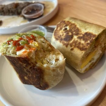 Melo Coffee & Kitchen - Breakfast burrito with extra egg no chorizo, have eaten delicious pancakes in the background. - Cafes Near Me - Rochester, New York Melo Coffee & Kitchen - Breakfast burrito with extra egg no chorizo, have eaten delicious pancakes in the background. - Cafes Near Me - Rochester, New York