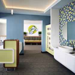 Hersch Pediatric Dentistry & Orthodontics - Reception and Check-Out with Spinner, our mascot, in the background.