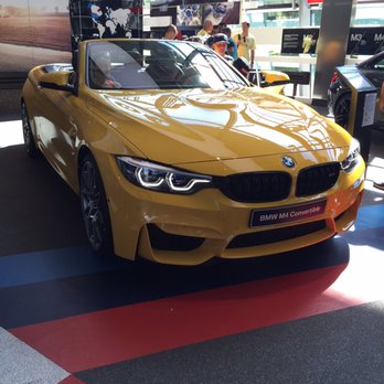 BMW Welt - Speed Yellow M4. - Car Dealers Near Me - Munich, BY BMW Welt - Speed Yellow M4. - Car Dealers Near Me - Munich, BY