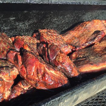 Bandera Brisket - the meat being cooked on the grill - Food Trucks Near Me