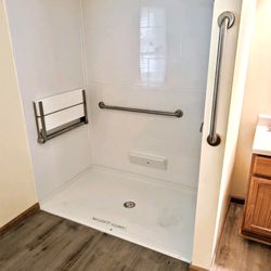 Prime Plumbing - Replaced standard bathtub with roll in shower