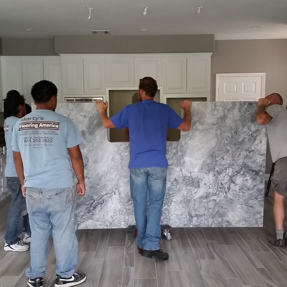 Marty's Flooring America - Great room install of wood - like porcelain tiles, countertops & backsplash by Greg and his team at Marty's Flooring America. - Flooring Near Me - Valencia, California Marty's Flooring America - Great room install of wood - like porcelain tiles, countertops & backsplash by Greg and his team at Marty's Flooring America. - Flooring Near Me - Valencia, California