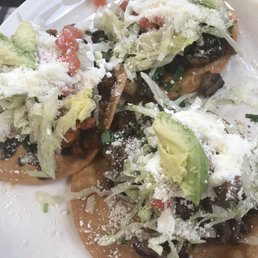 Tostadas (tongue, chirizo, pork). Tostadas (tongue, chirizo, pork).