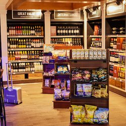 Lake Wine Kitchen + Bar - Grab and go market at Lake Wine with bottles of wine and snacks.