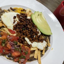 Huevos Rancheros w/ chorizo ($16) + coffee ($4). Huevos Rancheros w/ chorizo ($16) + coffee ($4).