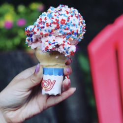Kristy's Whistle Stop - Strawberry ice cream cone with star sprinkles