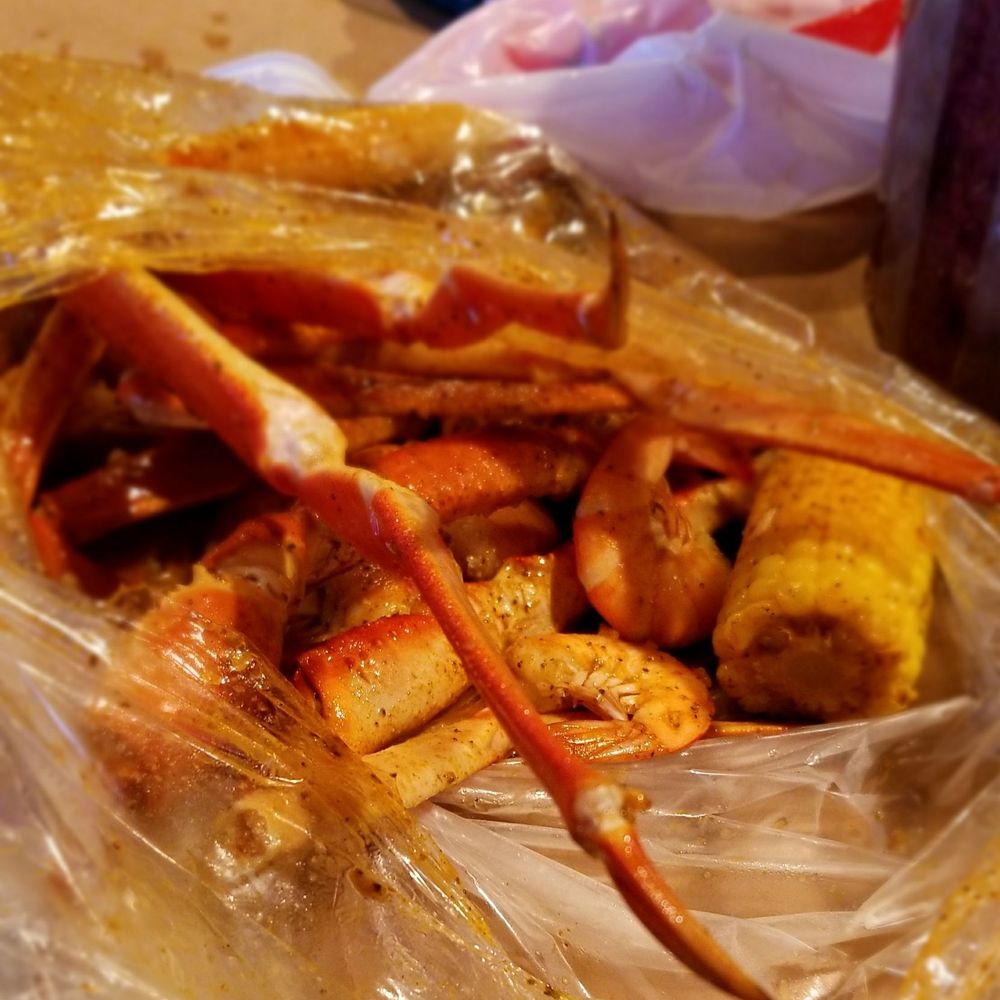 Crustacean Boil and Grill - Coops Combo - 2 clusters of snow crab legs and 1 lb of shrimp. Also included in the bag were red potatoes and sausage - Seafood Near Me - Henrico, Virginia Crustacean Boil and Grill - Coops Combo - 2 clusters of snow crab legs and 1 lb of shrimp. Also included in the bag were red potatoes and sausage - Seafood Near Me - Henrico, Virginia