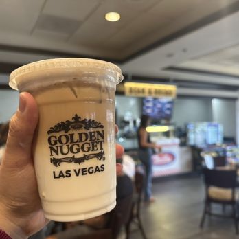 Bean & Bread - a hand holding a cup of golden nugget las vegas - Coffee & Tea Near Me - Laughlin, Nevada Bean & Bread - a hand holding a cup of golden nugget las vegas - Coffee & Tea Near Me - Laughlin, Nevada