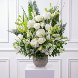 Florida Flowers - Large white funeral tribute featuring luxury flowers.