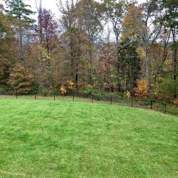 Snell Fence - I love how the black vinyl chain link fence blends with the background and doesn't overpower your view. - Fences & Gates Near Me