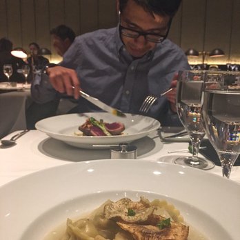 Rioja - A good looking guy inspecting a good looking tuna - New American Near Me - Denver, Colorado