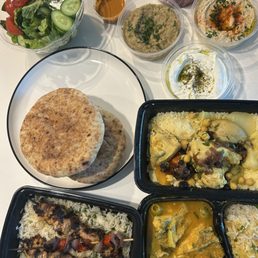 Greek salad, chicken tagine with lemon and olive sauce, chicken grill, chicken couscous, dips (labne, babaganoush, hummus)
