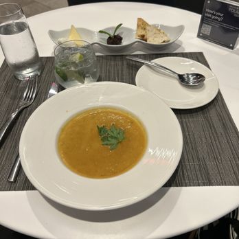 United Polaris - White Bean, Rosemary Soup with a cheese plate, gin & tonic at the dining room. - Airport Lounges Near Me - Los Angeles, California United Polaris - White Bean, Rosemary Soup with a cheese plate, gin & tonic at the dining room. - Airport Lounges Near Me - Los Angeles, California