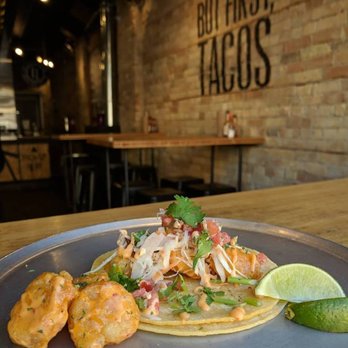 Dos Tacos - a plate of food on a table - Mexican Near Me - London, Ontario Dos Tacos - a plate of food on a table - Mexican Near Me - London, Ontario