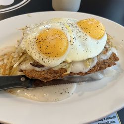Fountain City Grille - Cowboy Benedict Country fried steak with biscuit, gravy, hashbrowns and eggs