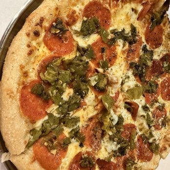 High Point Grill - Green chili Pepperoni Pizza - A pizza topped with pepperoni slices, chopped green chilies, and melted cheese, served on a metal tray. - Sandwiches Near Me - Albuquerque, New Mexico