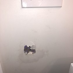Garnsey Bros Rentals - Lovely hole in the bathroom wall