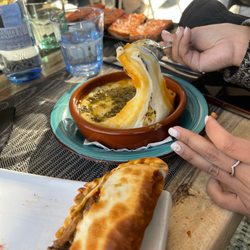 Morelia - Goat cheese empanada with pine nuts. Gooey baked mozzarella,