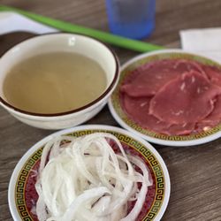 Pho Hoa - Pickled onions, rare steak on the side with a small bowl of hot broth